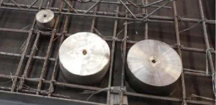 Insert magnet in the laminated slab after tying the bars