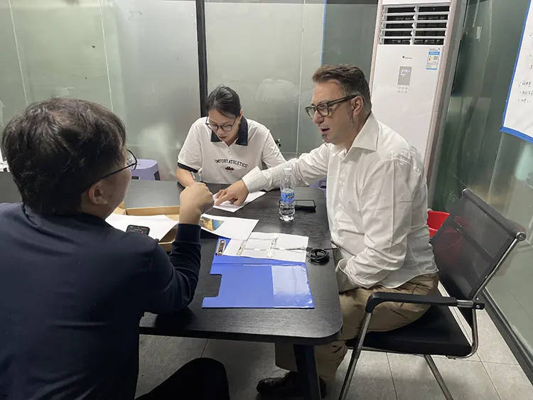 Negotiating cooperation in the QCM conference room